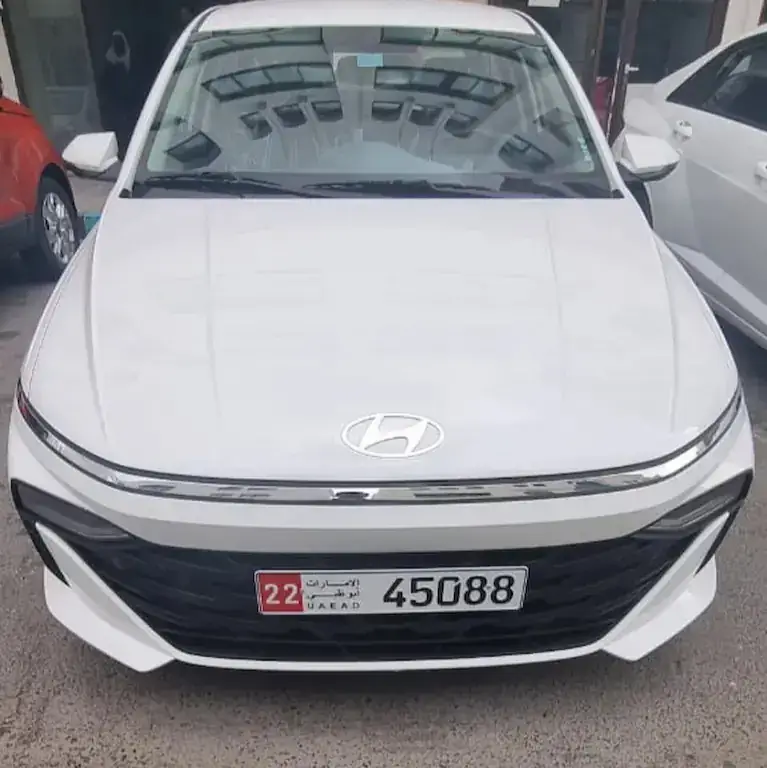 Front view of a white Hyundai Accent 2026 for rent in Abu Dhabi
